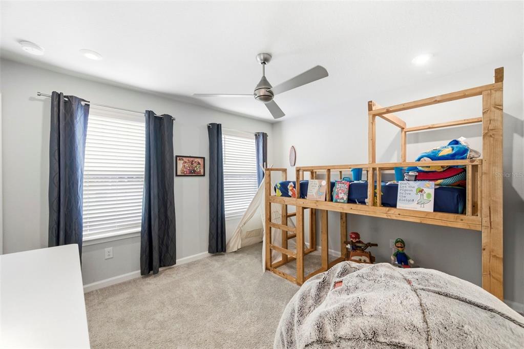 4327 Cloud Hopper Way Lutz, FL 33559 - Photo 34 of 75 a bed room with a bed and a window