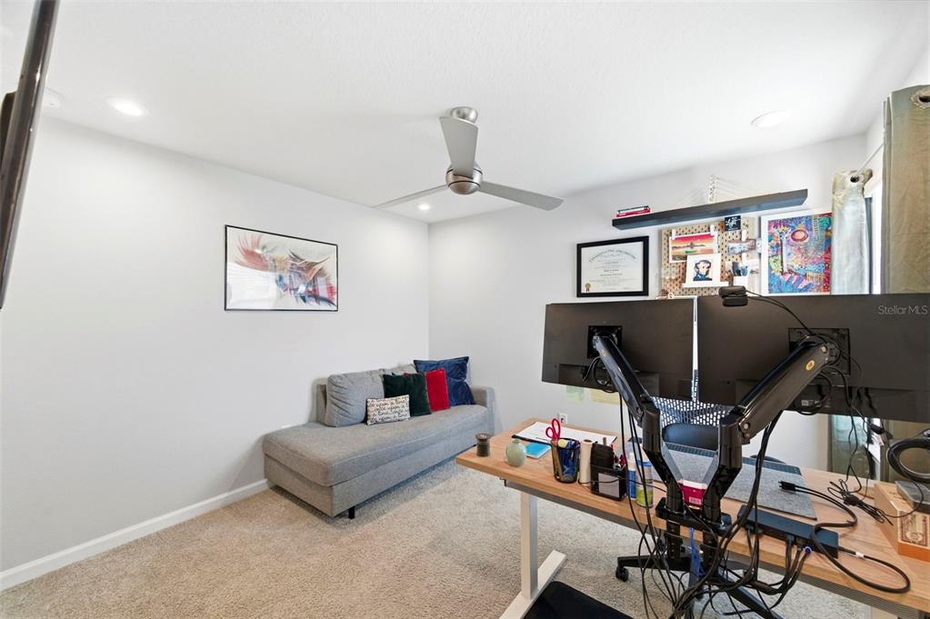 4327 Cloud Hopper Way Lutz, FL 33559 - Photo 37 of 75 a living room with furniture and a flat screen tv