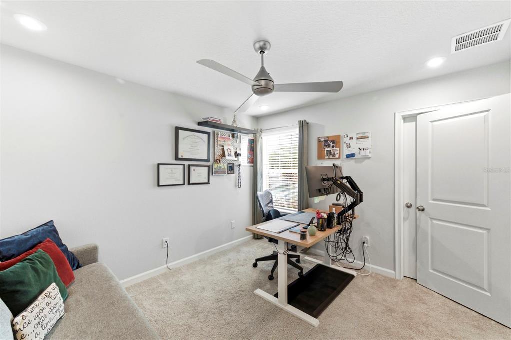 4327 Cloud Hopper Way Lutz, FL 33559 - Photo 38 of 75 a living room with furniture a air conditioner and a window