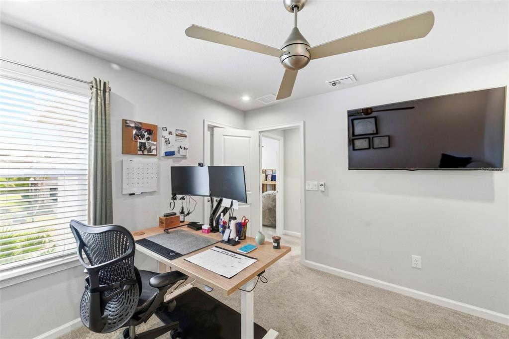 4327 Cloud Hopper Way Lutz, FL 33559 - Photo 39 of 75 a workspace with furniture and window