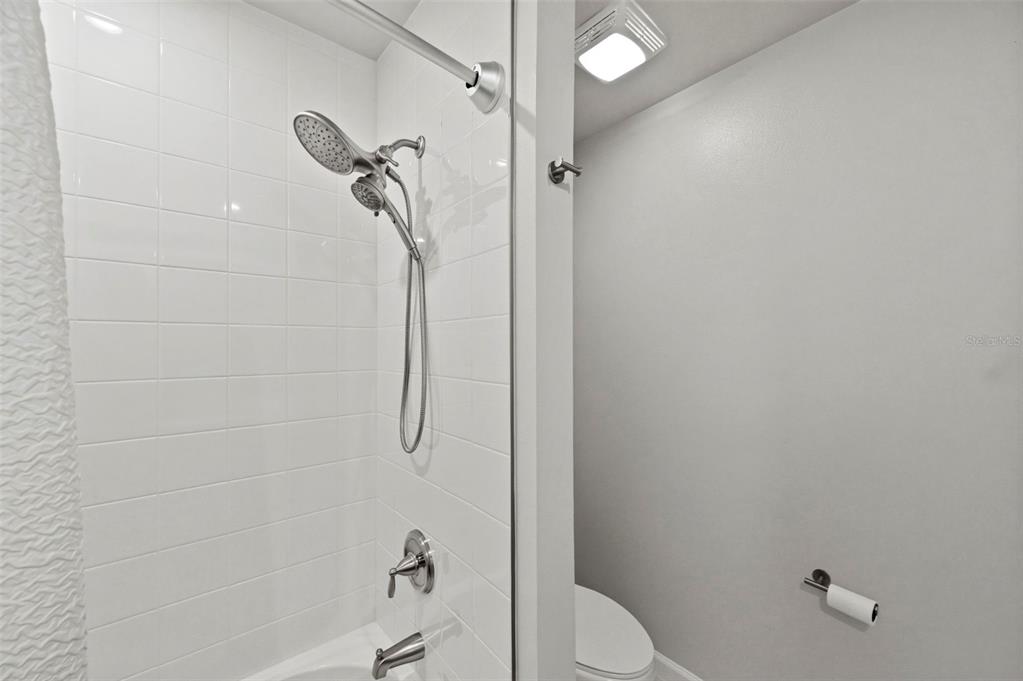 4327 Cloud Hopper Way Lutz, FL 33559 - Photo 42 of 75 a bathroom with a shower and toilet