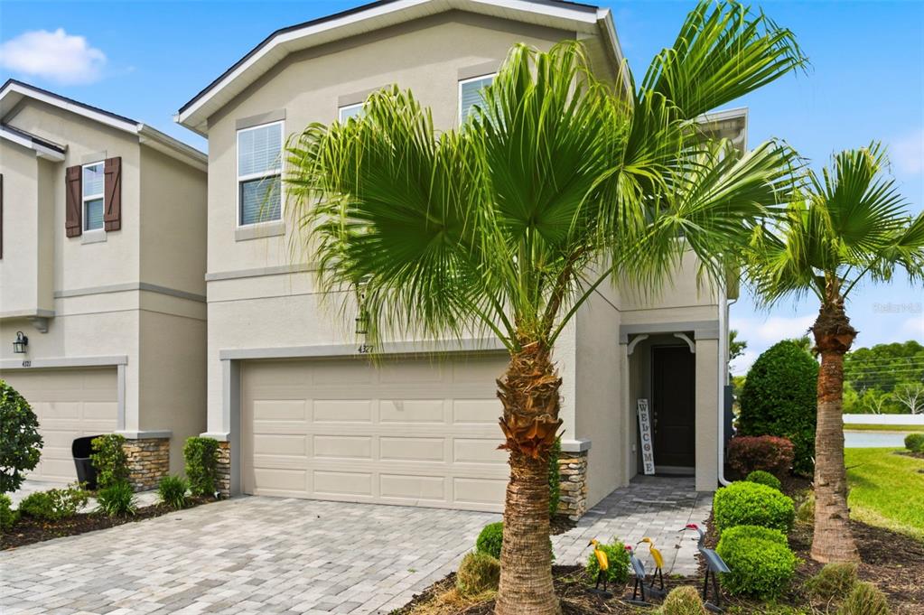 4327 Cloud Hopper Way Lutz, FL 33559 - Photo 5 of 75 a front view of a house with a yard