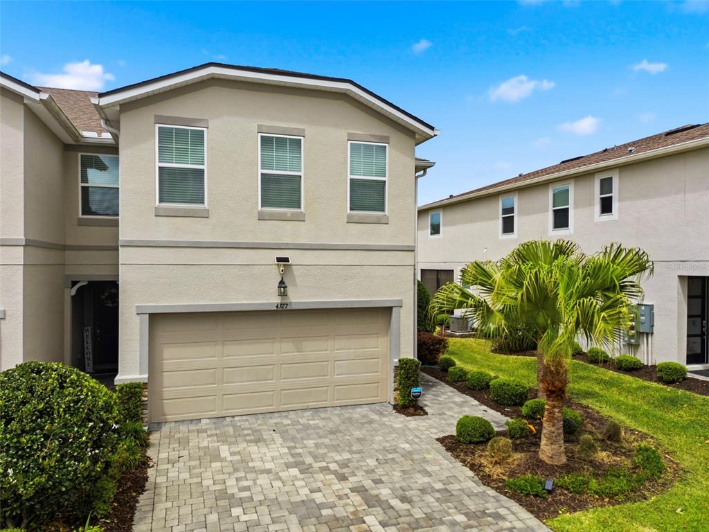 4327 Cloud Hopper Way Lutz, FL 33559 - Photo 52 of 75 a front view of a house with garden