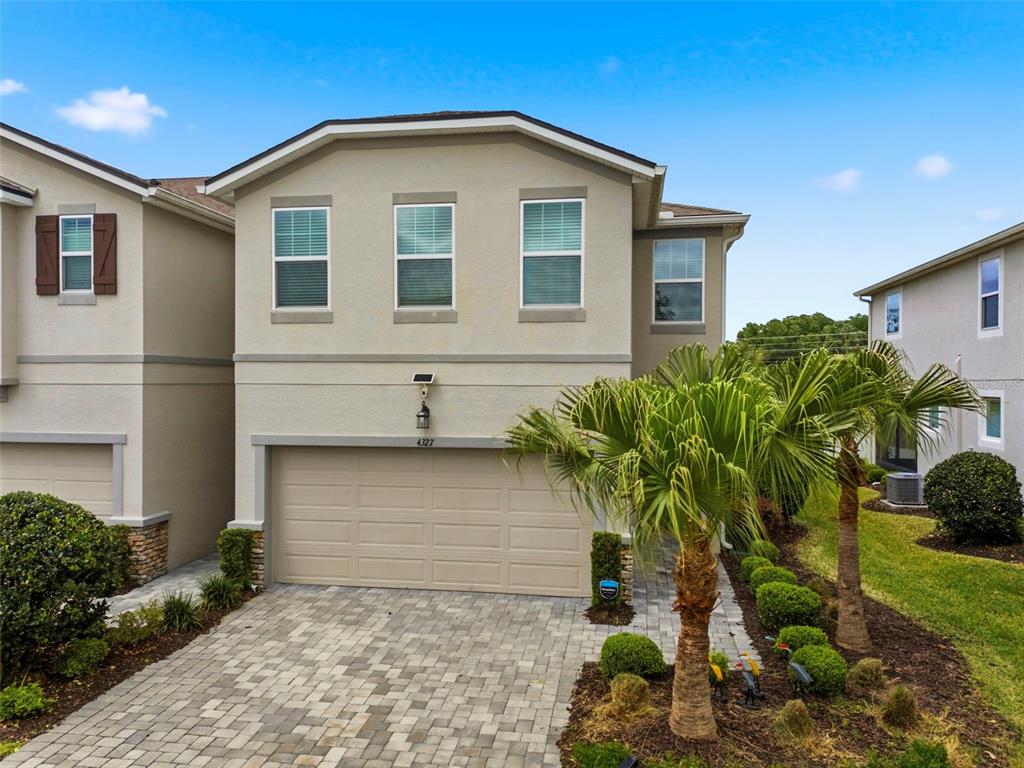 4327 Cloud Hopper Way Lutz, FL 33559 - Photo 54 of 75 a front view of a house with a yard