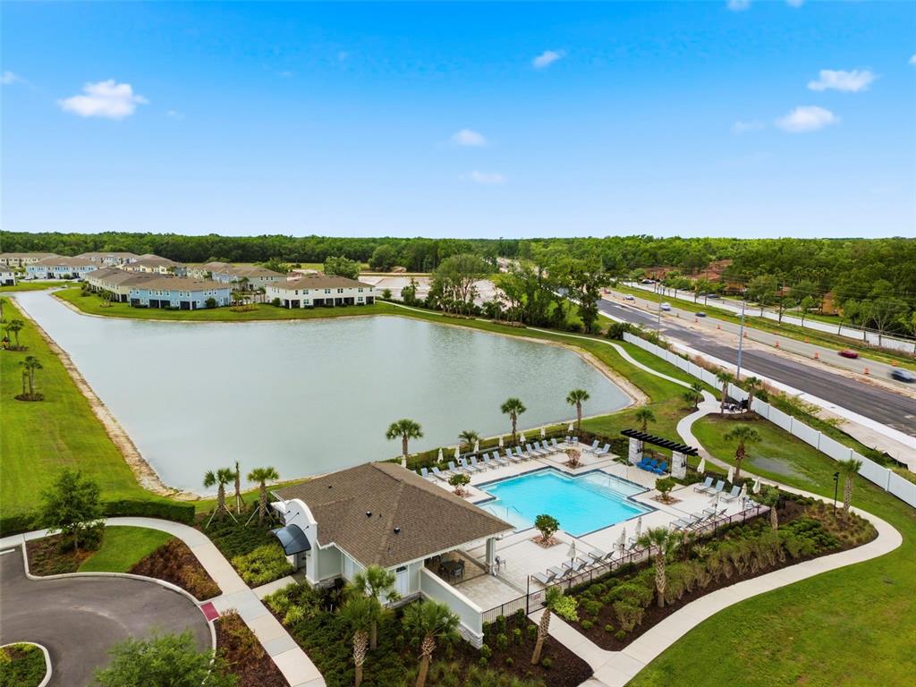 4327 Cloud Hopper Way Lutz, FL 33559 - Photo 56 of 75 an aerial view of a house with a lake view