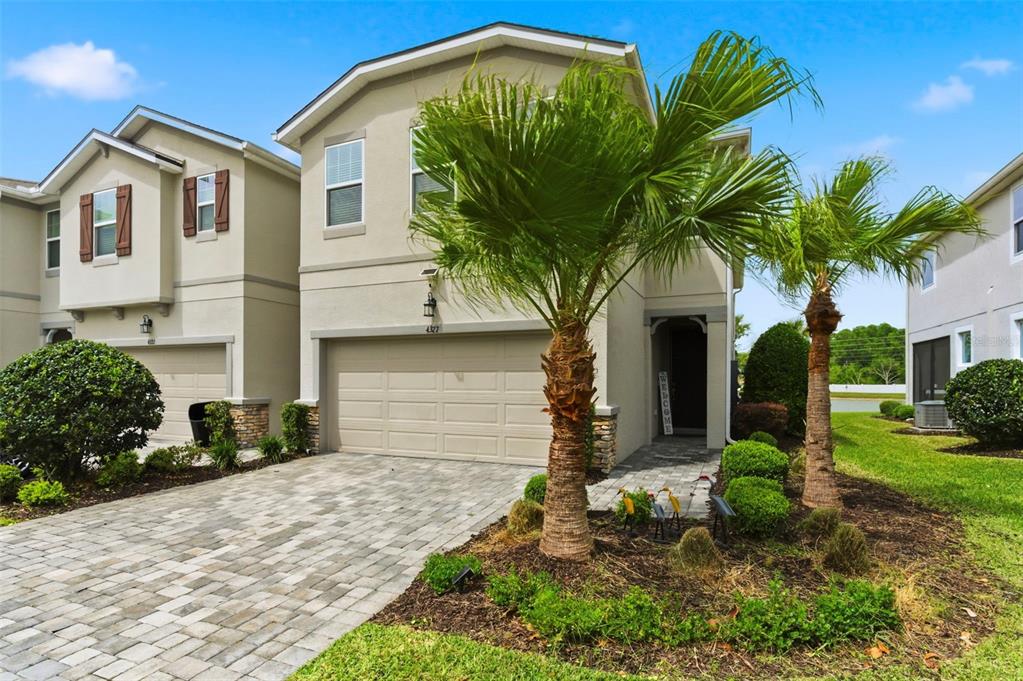 4327 Cloud Hopper Way Lutz, FL 33559 - Photo 6 of 75 a front view of a house with garden