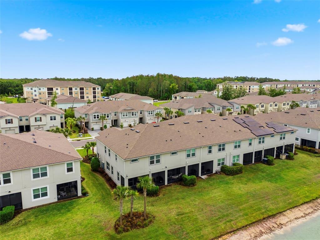 4327 Cloud Hopper Way Lutz, FL 33559 - Photo 72 of 75 a view of a big house with a big yard and large trees