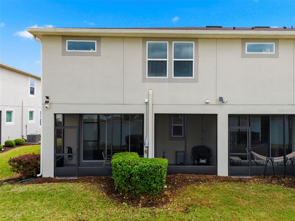 4327 Cloud Hopper Way Lutz, FL 33559 - Photo 74 of 75 a view of an house with backyard space and porch
