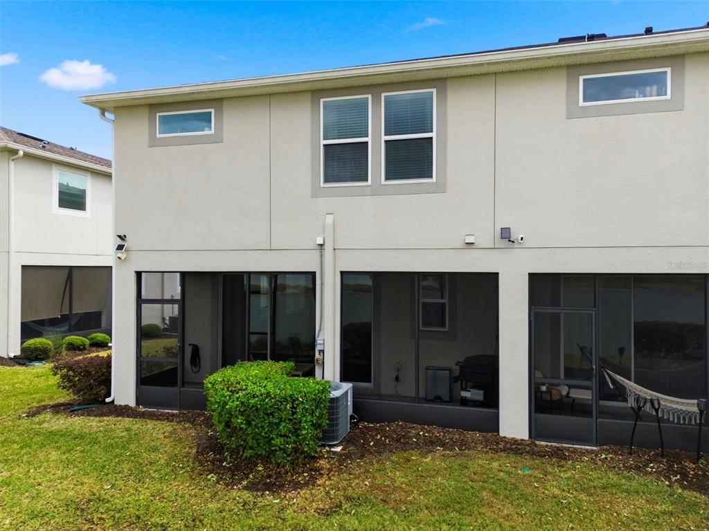4327 Cloud Hopper Way Lutz, FL 33559 - Photo 75 of 75 a view of a house with a yard and sitting area