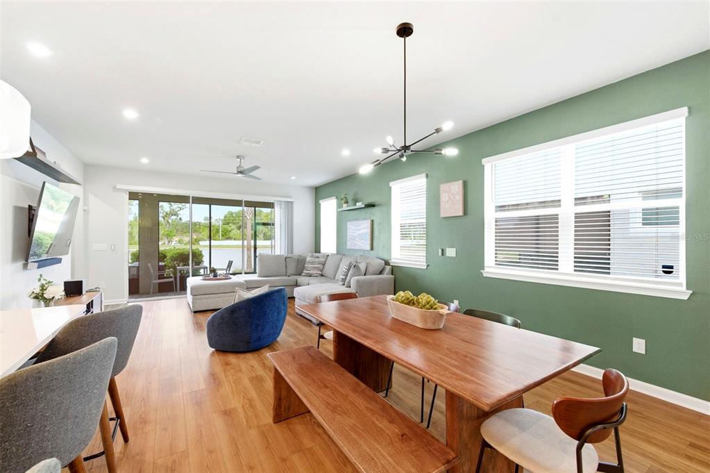 4327 Cloud Hopper Way Lutz, FL 33559 - Photo 8 of 75 a large kitchen with a table and chairs