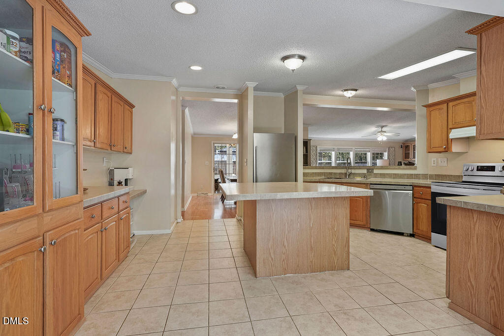 251 Ridge View Drive Cameron, NC 28326 - Photo 22 of 44 a large kitchen with stainless steel appliances lots of counter top space
