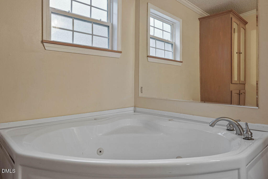 251 Ridge View Drive Cameron, NC 28326 - Photo 28 of 44 a bathroom with bathtub and window