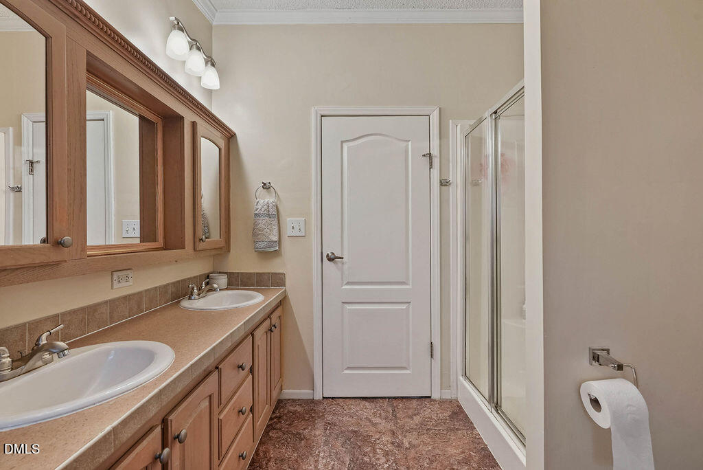 251 Ridge View Drive Cameron, NC 28326 - Photo 30 of 44 a bathroom with a sink a vanity and a mirror