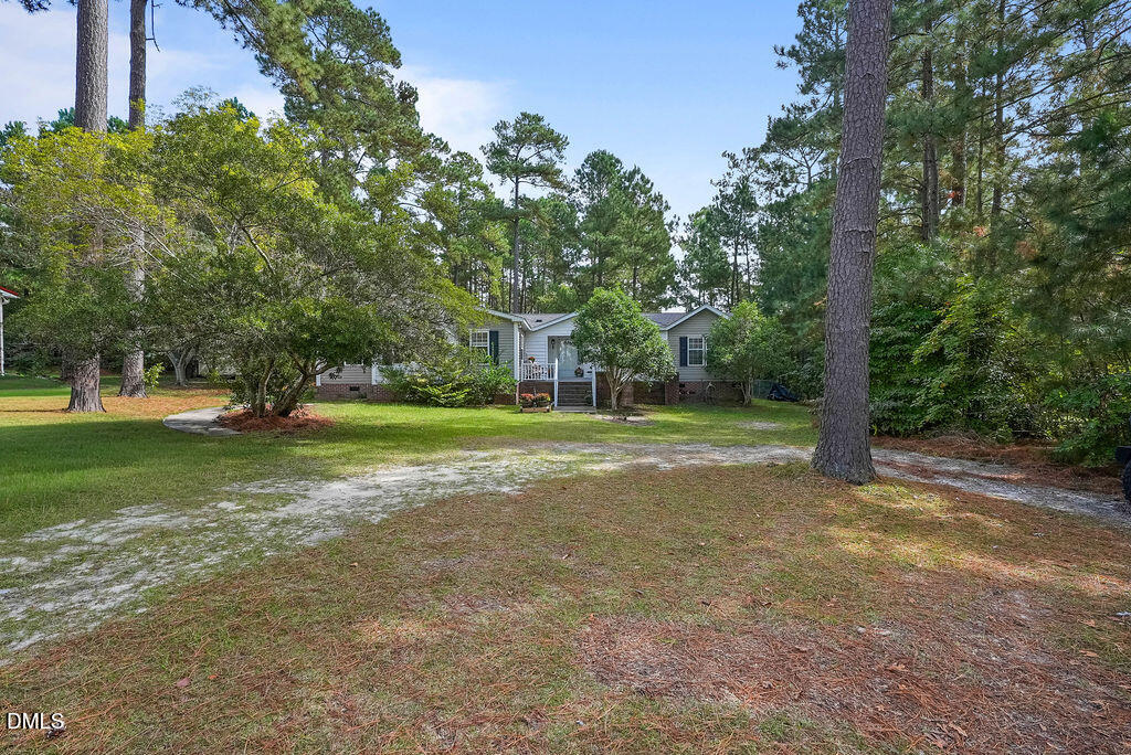 251 Ridge View Drive Cameron, NC 28326 - Photo 3 of 44 a view of a house with a big yard