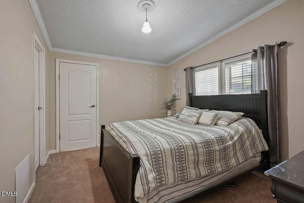 251 Ridge View Drive Cameron, NC 28326 - Photo 31 of 44 a bedroom with a bed and window