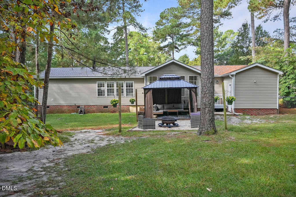251 Ridge View Drive Cameron, NC 28326 - Photo 38 of 44 a view of a house with backyard and a tree