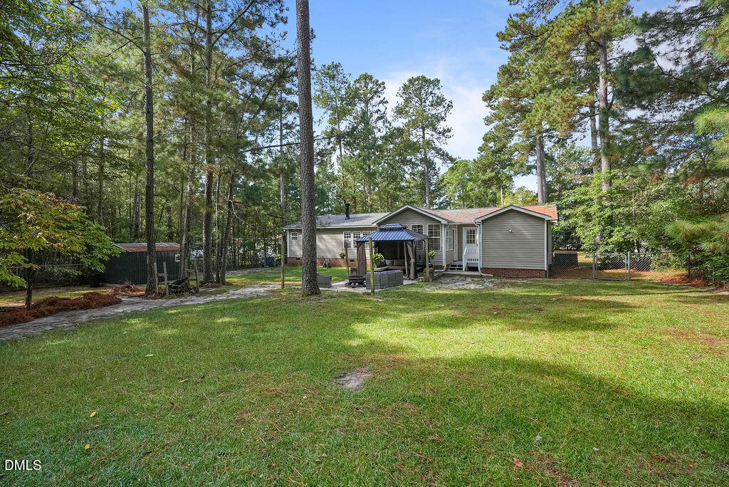 251 Ridge View Drive Cameron, NC 28326 - Photo 41 of 44 a front view of a house with a garden