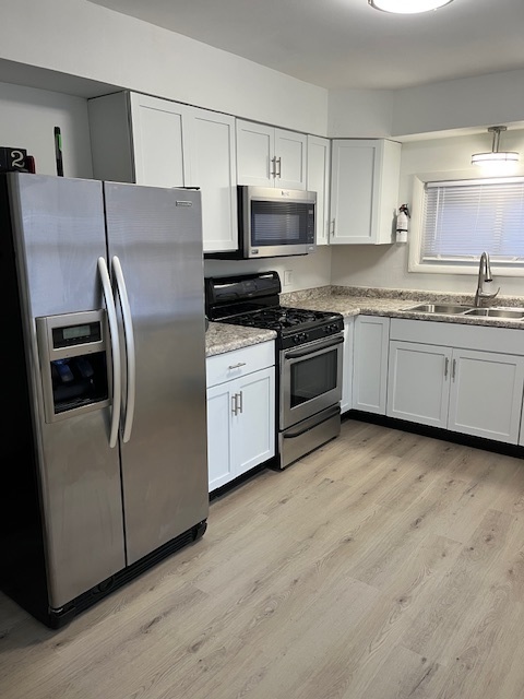 3027 Wilshire Avenue Markham, IL 60428 - Photo 7 of 16 a kitchen with stainless steel appliances granite countertop a refrigerator a stove top oven a sink and dishwasher