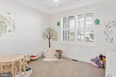a bathroom with a sink mirror and toilet