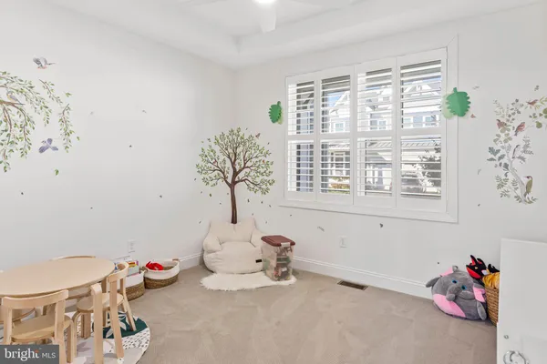 a bathroom with a sink mirror and toilet