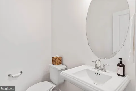 a utility room with sink dryer and washer