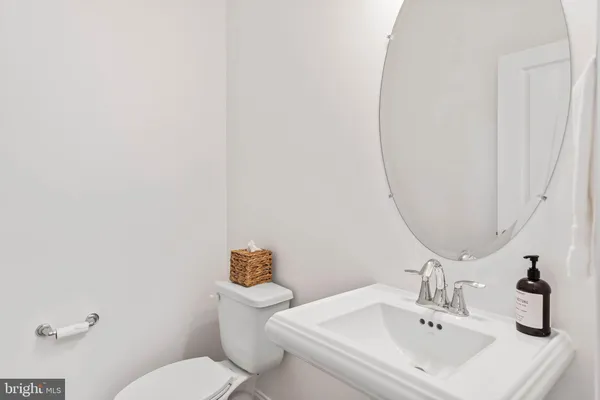 a utility room with sink dryer and washer