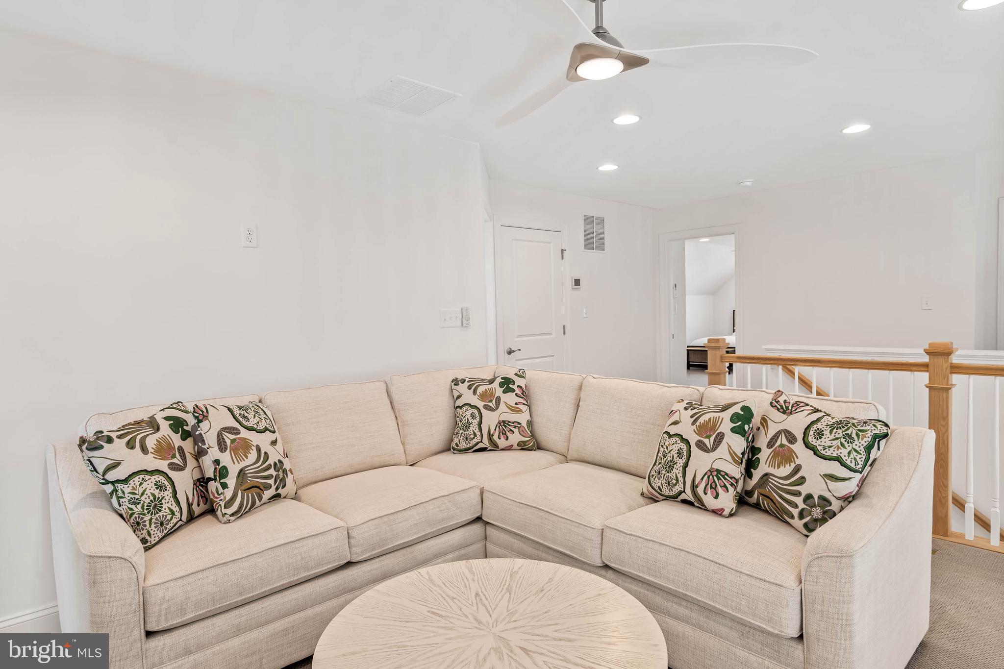 30468 Madeira Lane Ocean View, DE 19970 - Photo 22 of 56 a living room with furniture and a couch