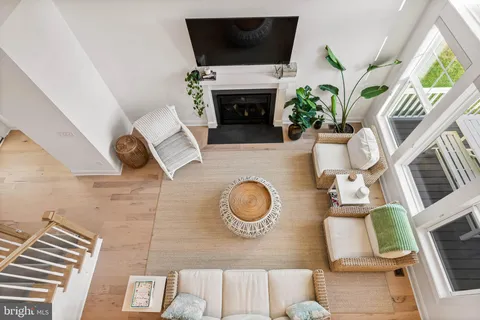 a bedroom with a bed a chandelier and a couch