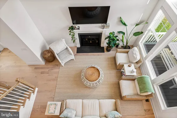 a bedroom with a bed a chandelier and a couch