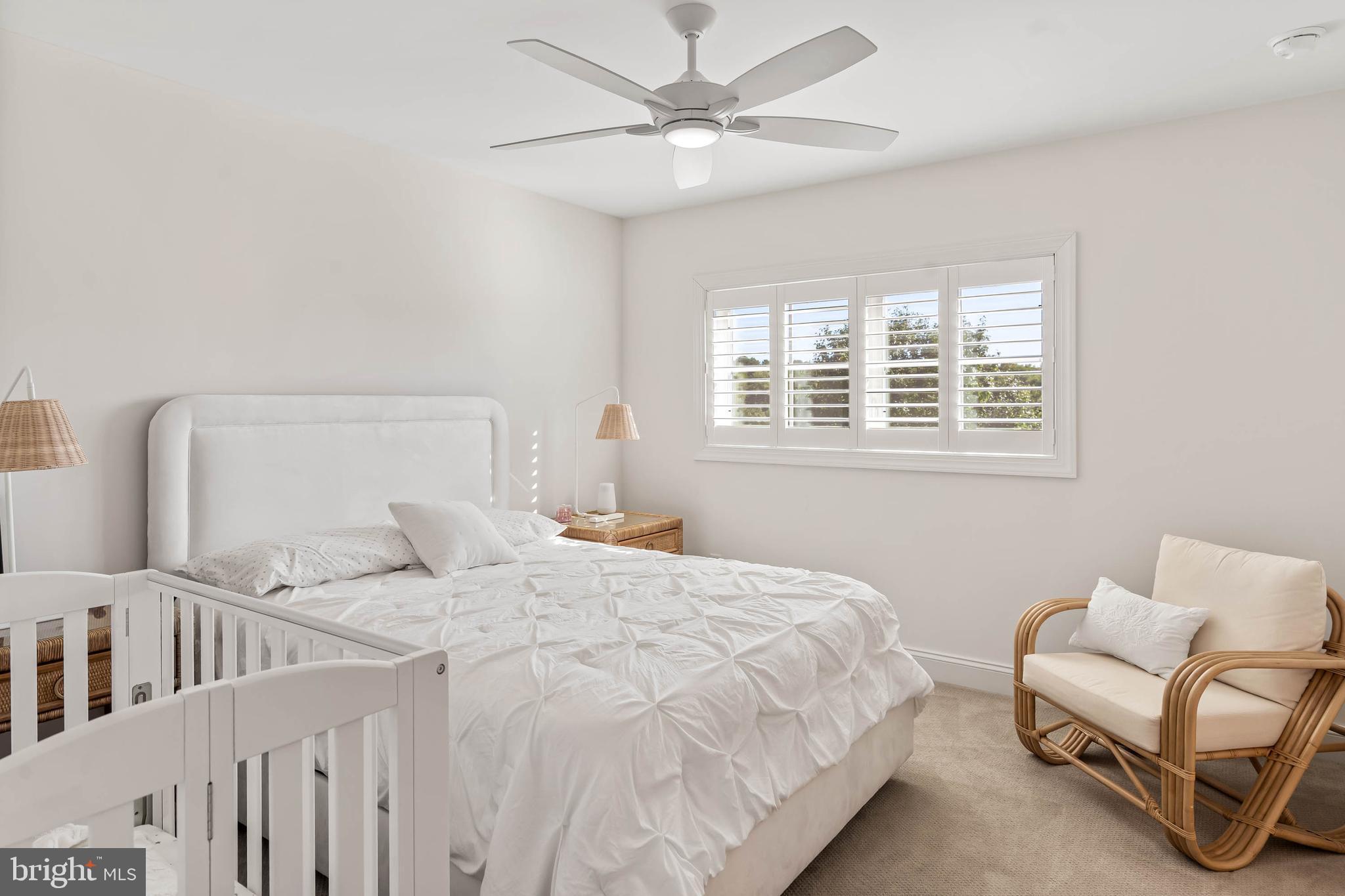30468 Madeira Lane Ocean View, DE 19970 - Photo 24 of 56 a bedroom with a bed a chandelier and a couch
