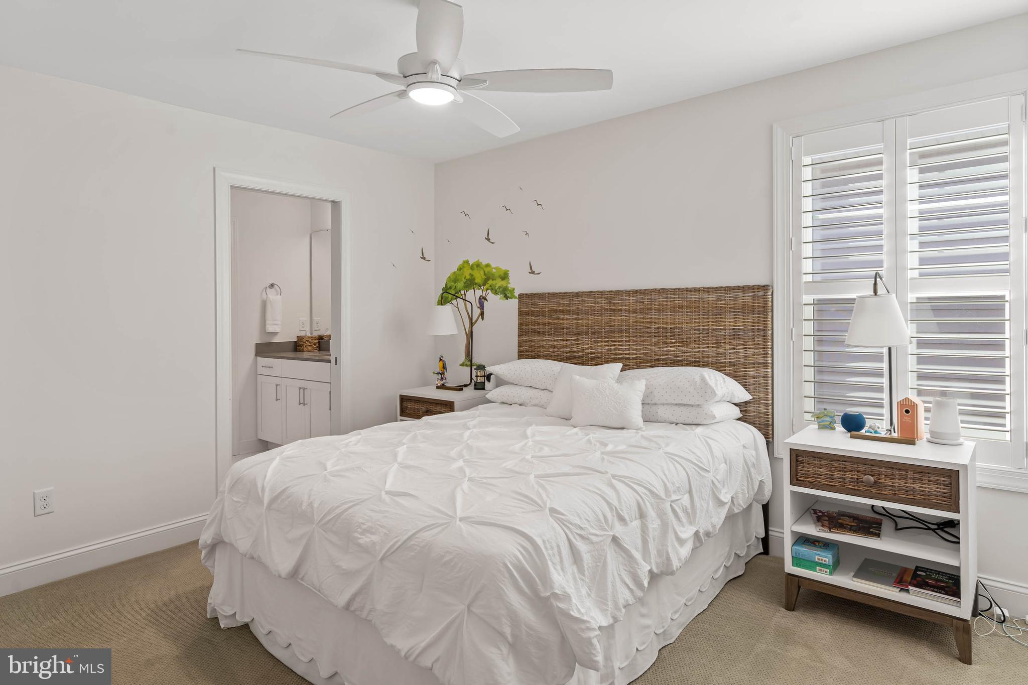 30468 Madeira Lane Ocean View, DE 19970 - Photo 27 of 56 a bedroom with a bed and a ceiling fan