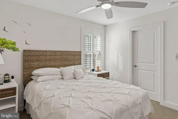 a bedroom with furniture and window