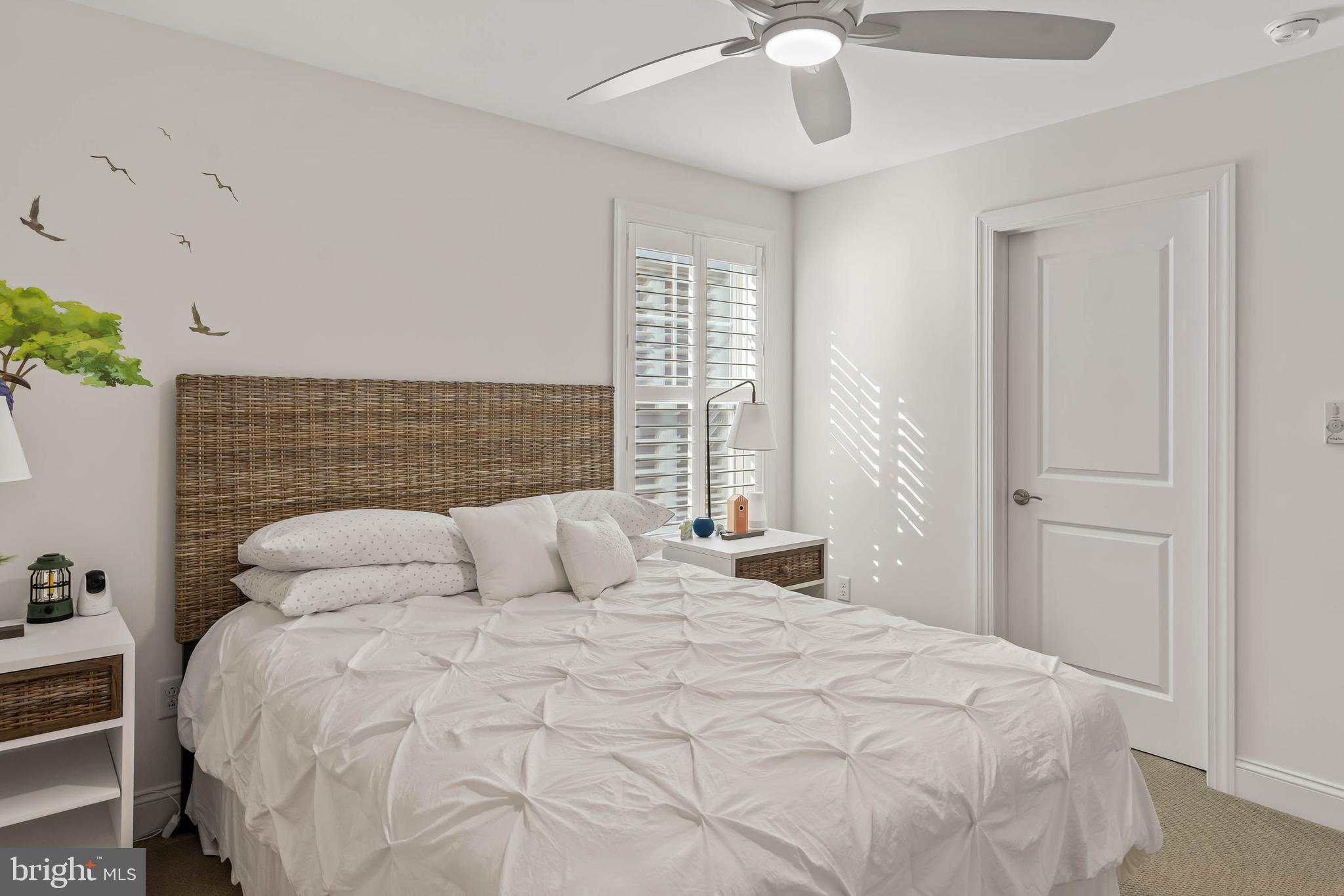 30468 Madeira Lane Ocean View, DE 19970 - Photo 28 of 56 a bedroom with a bed and a chandelier