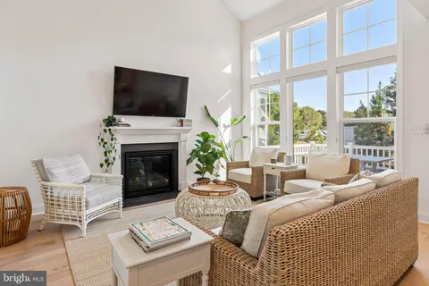 a living room with fireplace furniture and a flat screen tv