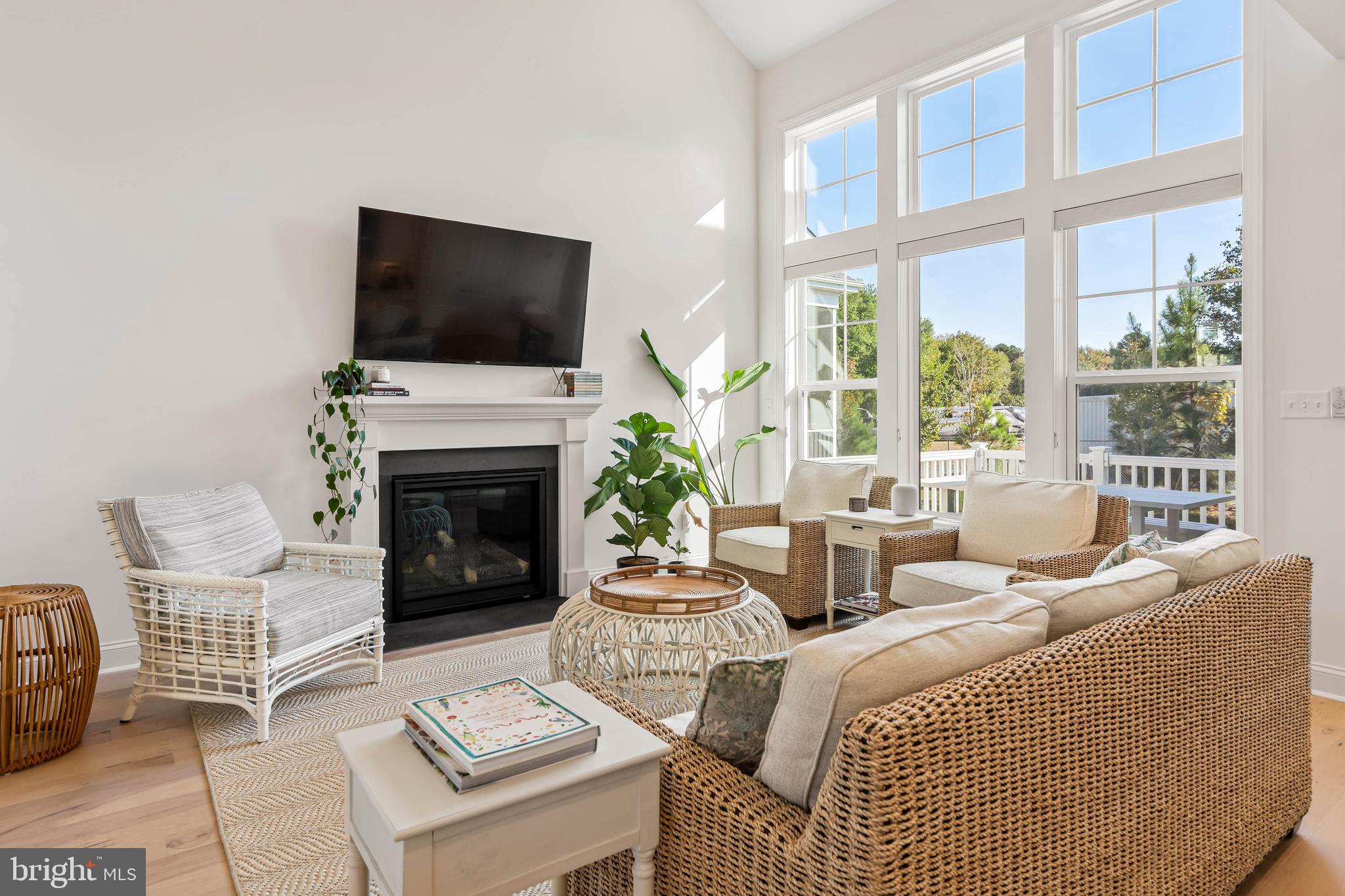 30468 Madeira Lane Ocean View, DE 19970 - Photo 3 of 56 a living room with fireplace furniture and a flat screen tv