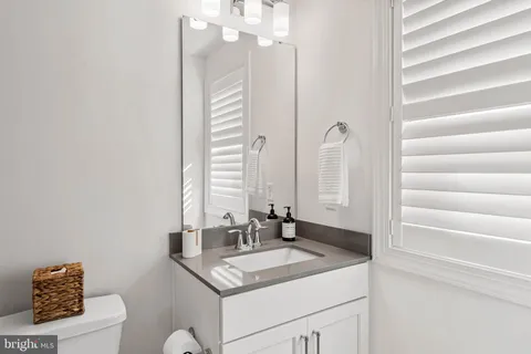 a front view of a house with a yard and porch