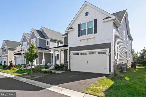 an aerial view of residential houses and outdoor space