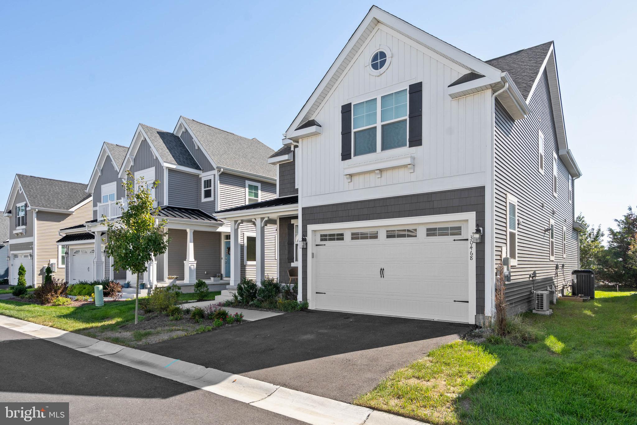 30468 Madeira Lane Ocean View, DE 19970 - Photo 42 of 56 a front view of a house with a yard