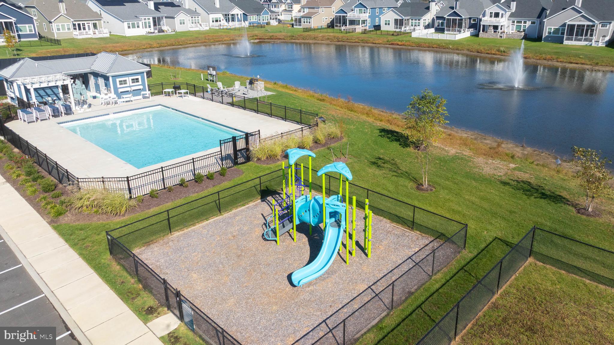 30468 Madeira Lane Ocean View, DE 19970 - Photo 55 of 56 a view of a swimming pool with a yard