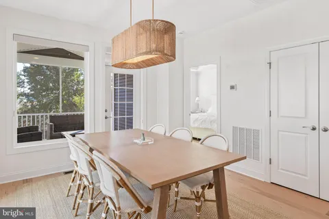 a view of a dining table and chairs in a room