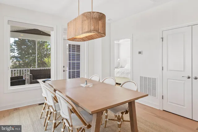 a view of a dining table and chairs in a room