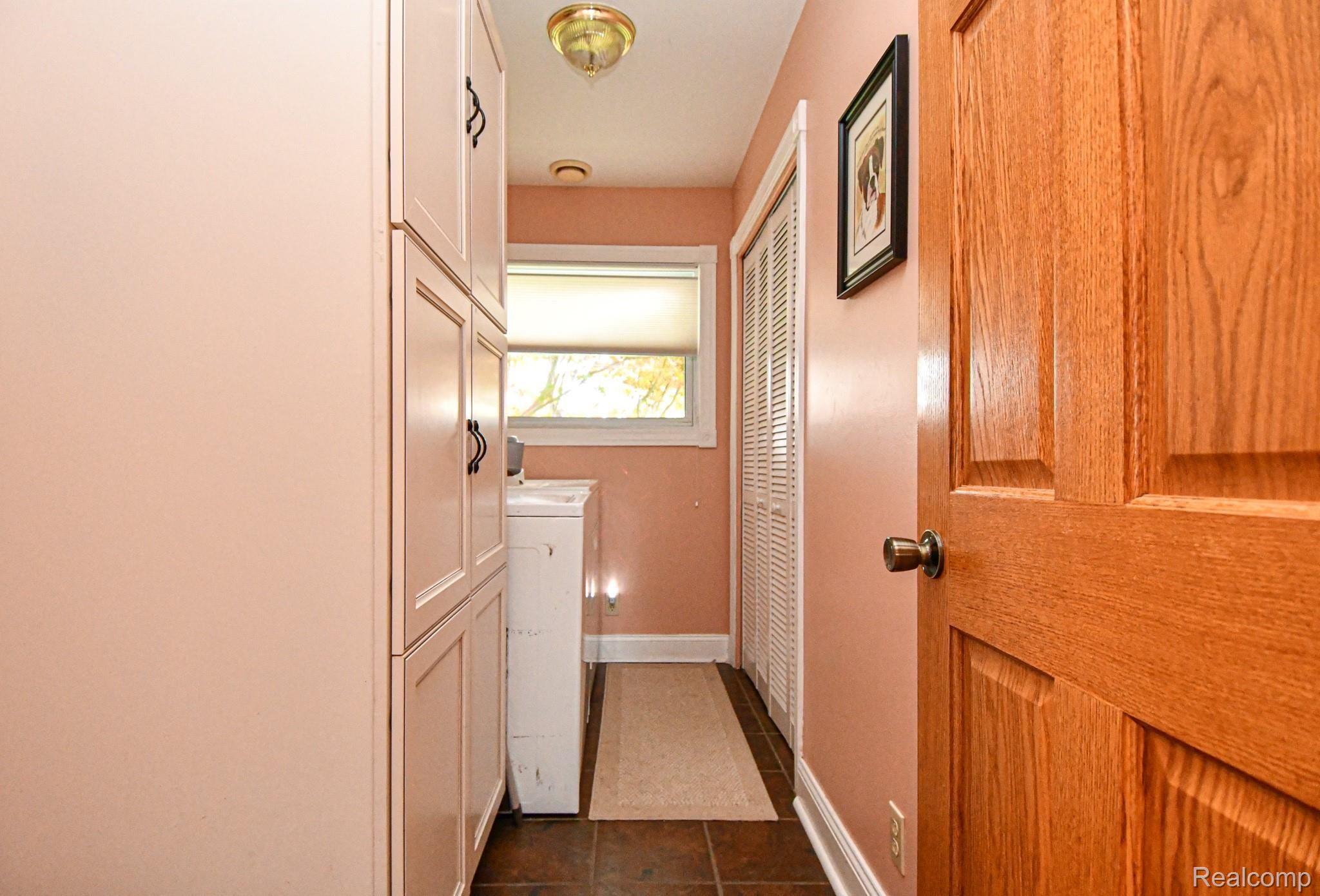 10376 Sharp Road Swartz Creek, MI 48473 - Photo 23 of 62 LAUNDRY WITH PLENTY OF STORAGE