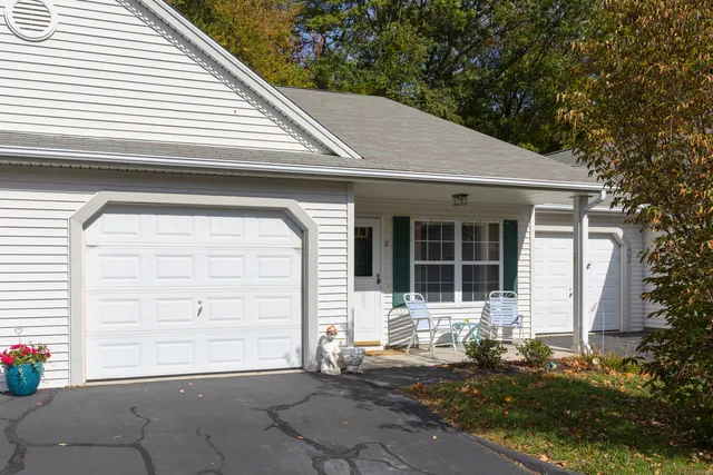 a front view of a house with a garage