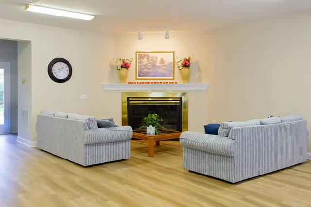 a room with furniture and a wooden floor
