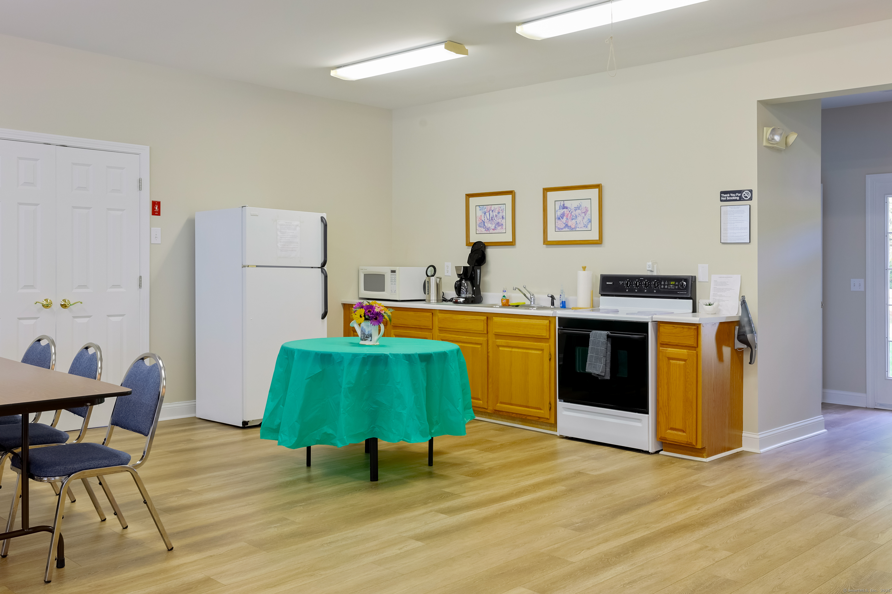 150 Forest Road, Unit 6 Milford, CT 06461 - Photo 24 of 26 a room with furniture and a wooden floor