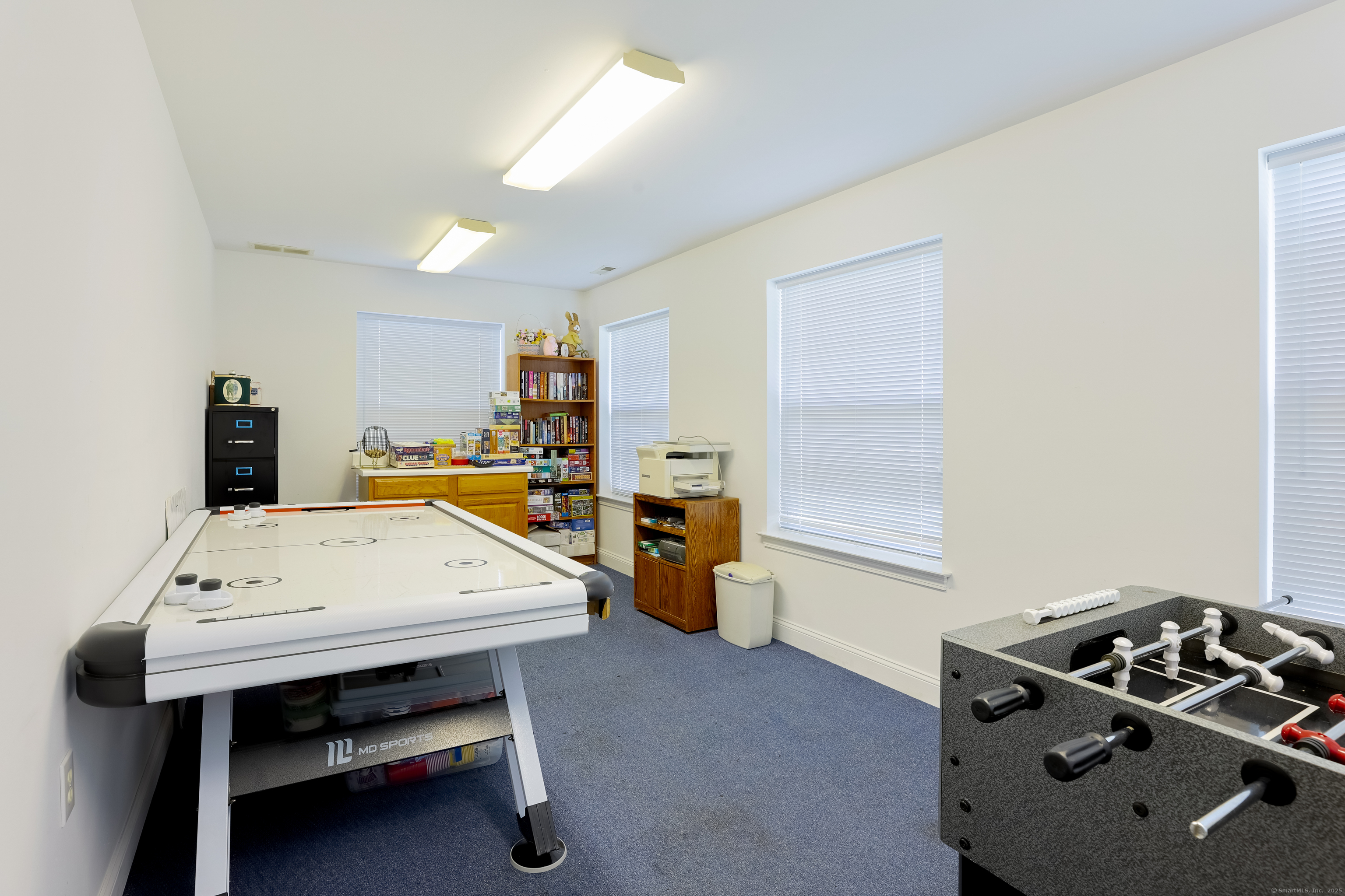150 Forest Road, Unit 6 Milford, CT 06461 - Photo 26 of 26 a room with furniture and air hockey table