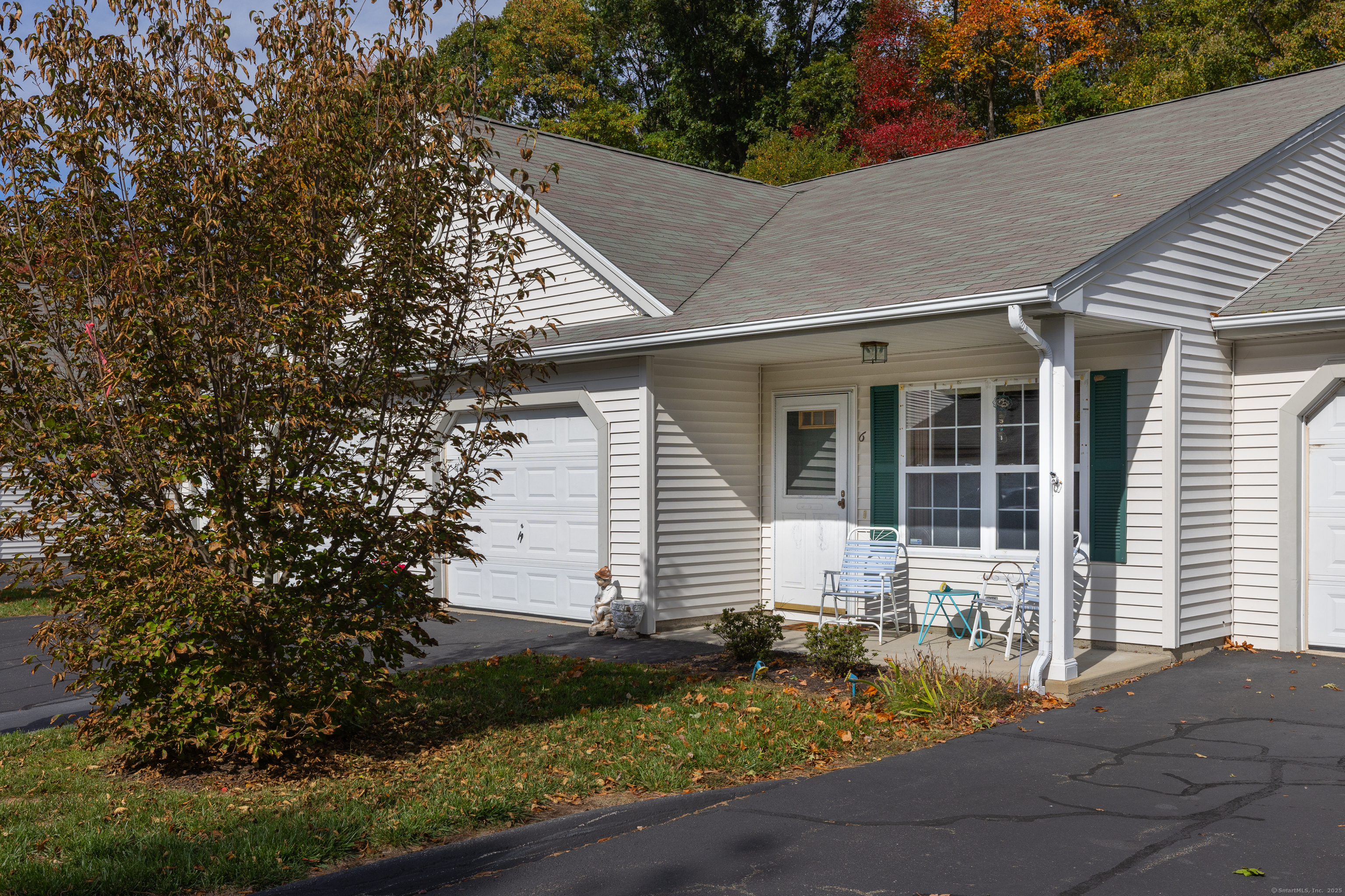 150 Forest Road, Unit 6 Milford, CT 06461 - Photo 3 of 26 a front view of a house with garden