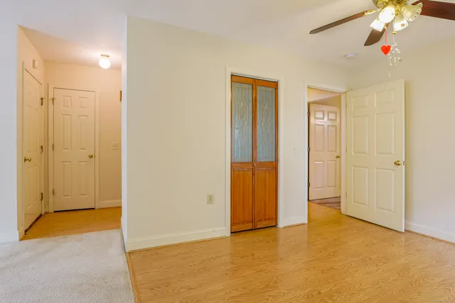 a view of an empty room with a bathroom