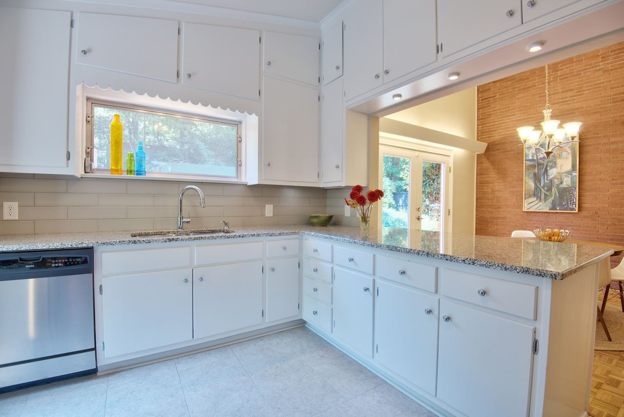1207 Woodburn Road Durham, NC 27705 - Photo 8 of 25 Plenty of cabinet storage in this efficient use of space! You'll appreciate having a place for everything & everything in it's place. Cabinets Abound