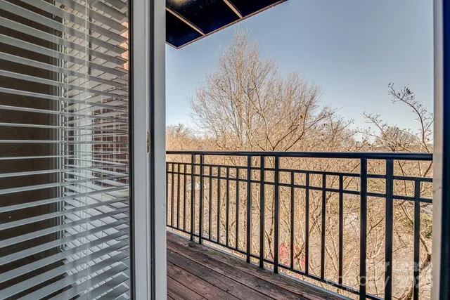 a view of a balcony with a pot